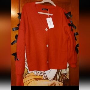 Elegant Red Cardigan with Black Ribbon Accents